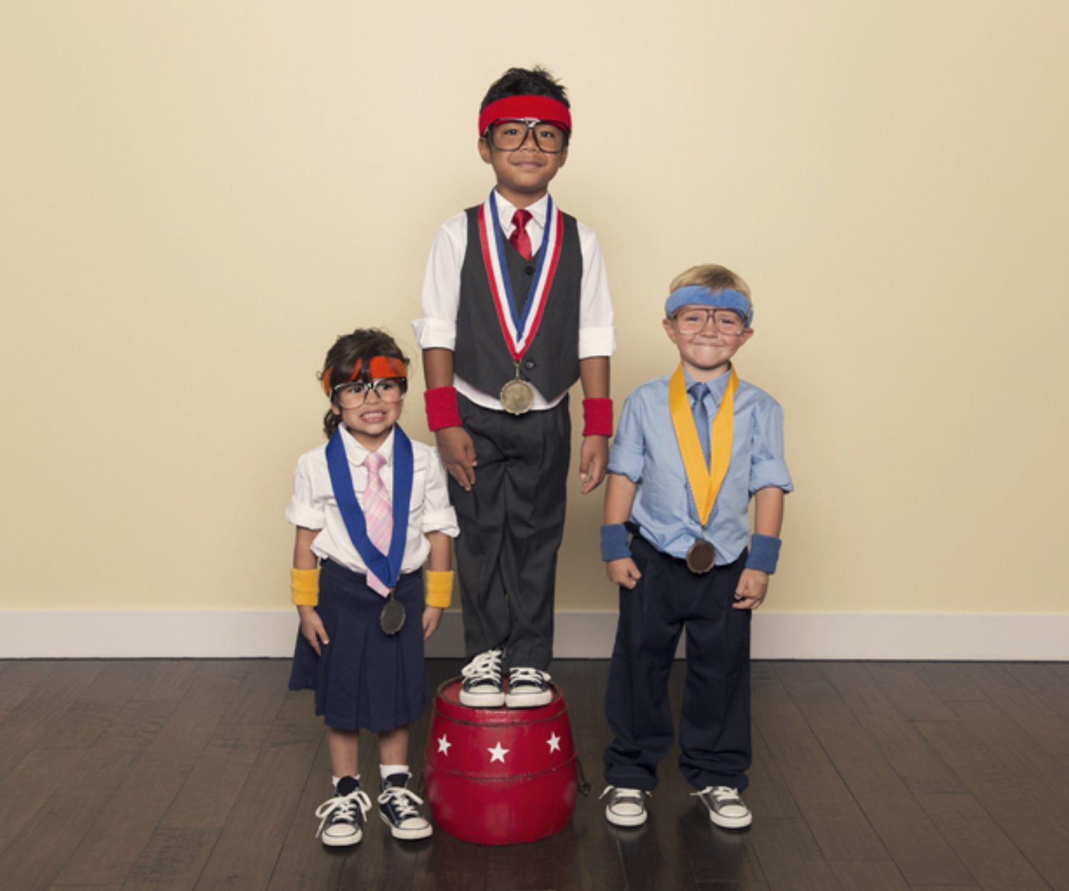 Young Children wearing Medals from Office Competition